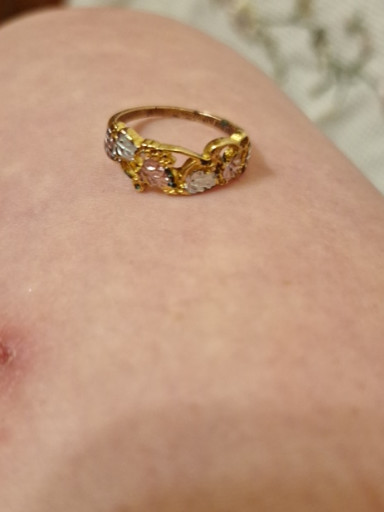 Tri-color gold ring with floral or decorative openwork design