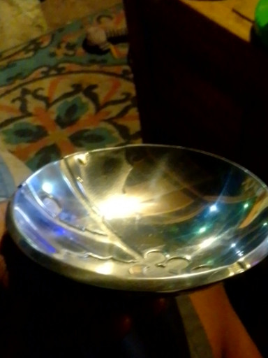 Aluminum alloy serving bowl with embossed holly design