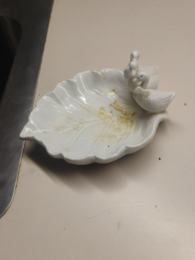White porcelain leaf-shaped trinket dish with dove figurine
