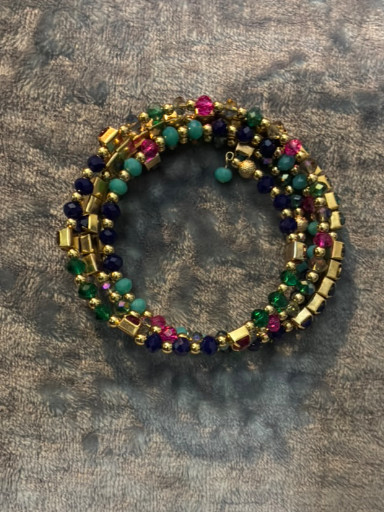 Multi-strand beaded bracelet with gemstones and gold-tone accents