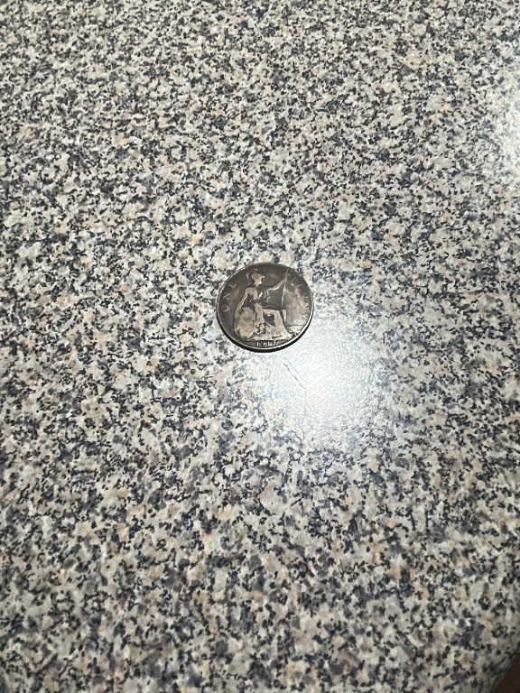 British penny coin featuring Britannia