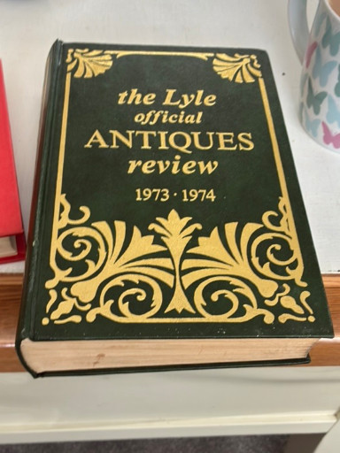 Hardcover reference book titled 'The Lyle Official Antiques Review 1973-1974' published by Lyle Publications