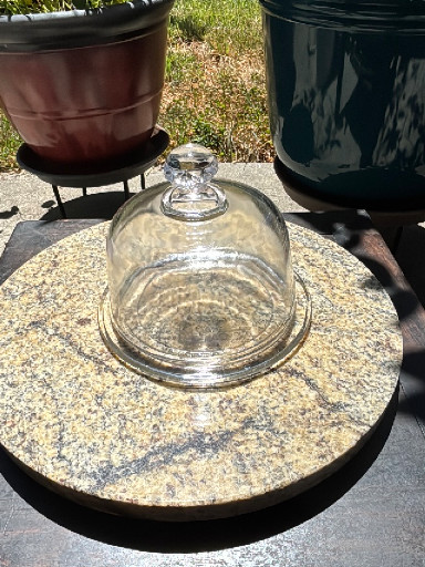 Clear pressed glass cheese stand with dome cover.