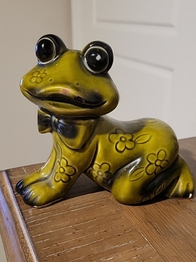 Ceramic frog figurine with floral decoration