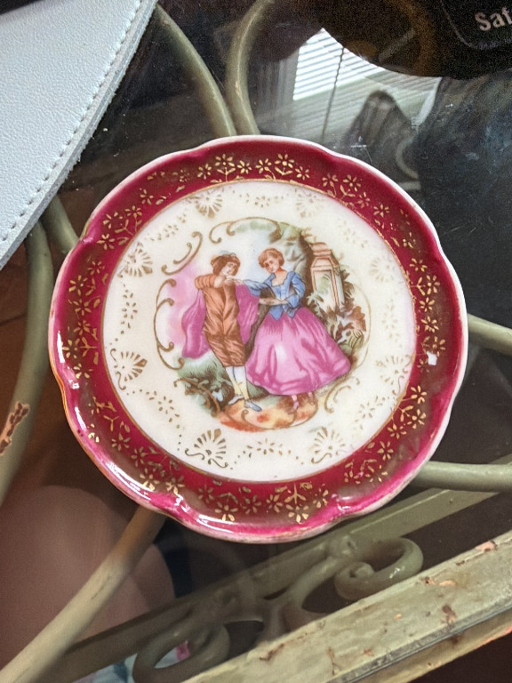 Porcelain decorative plate with Fragonard-style courting couple scene, Limoges, France