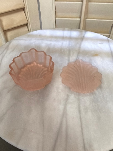 Pink frosted glass shell-shaped trinket box. 
4” tall x 3-1/2” wide x 1-1/2” tall.
