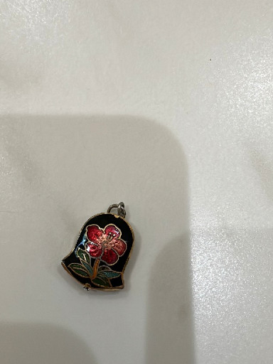 Cloisonné enamel pendant featuring red flowers