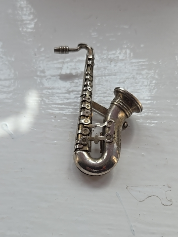Silver-tone metal saxophone brooch