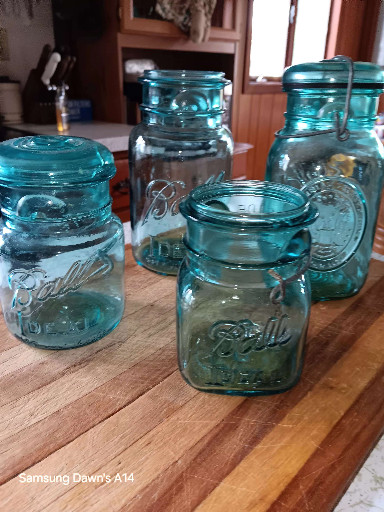 Vintage aqua blue glass canning jars with wire bail lids by Ball Ideal