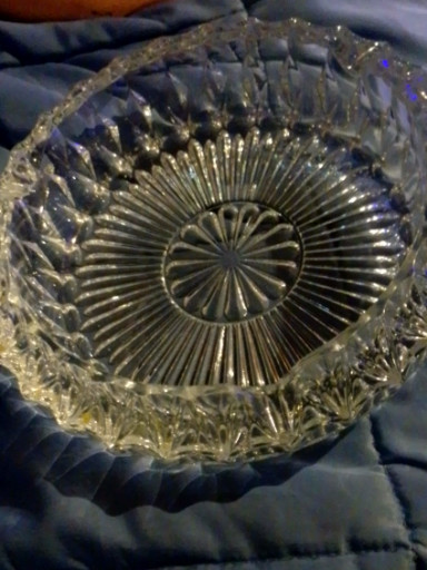 Pressed glass ashtray with starburst pattern