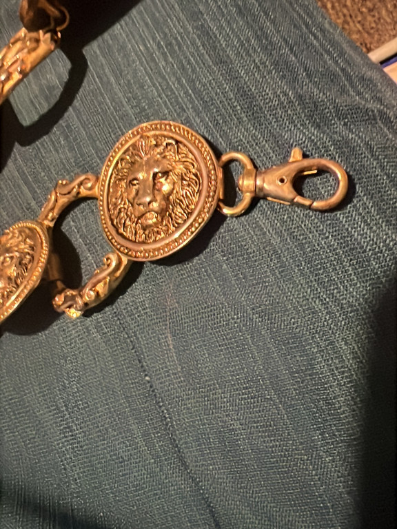Brass-tone chain necklace or belt with lion medallion by Anne Klein