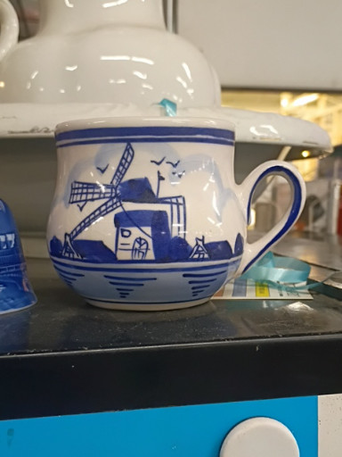 Ceramic mug with Dutch windmill scene in Delft blue style
