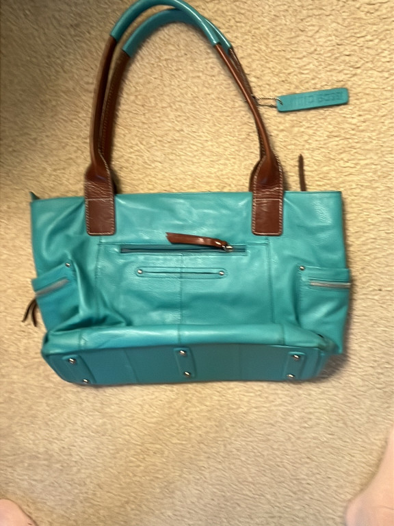 Leather tote handbag in turquoise with brown trim by Nino Bossi