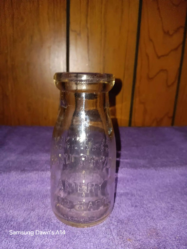Glass half-pint milk bottle from Utica Sanitary Milk Co.