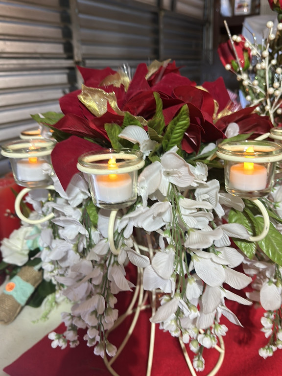 Decorative candle holder with artificial poinsettia and white flowers