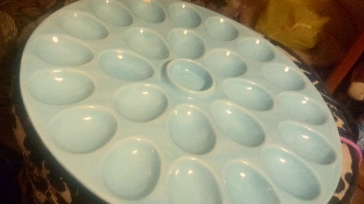 Ceramic pedestal deviled egg platter with center sauce well by TAG