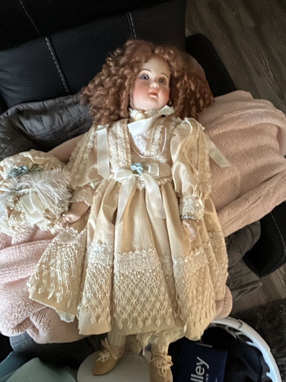 Porcelain reproduction doll of Tête Jumeau by Patricia Loveless