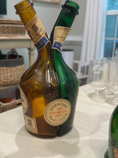Glass liqueur bottle titled 'The Couple' by Benedictine