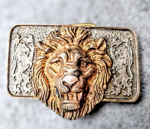 Brass belt buckle with lion head design