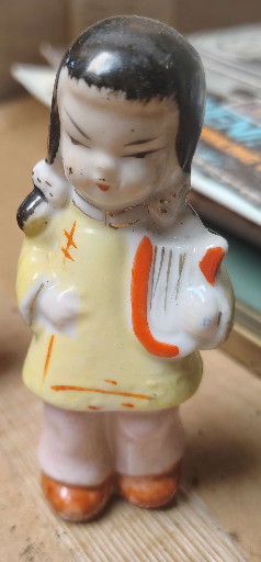 Ceramic figurine of a child with lyre, Japanese post-war export