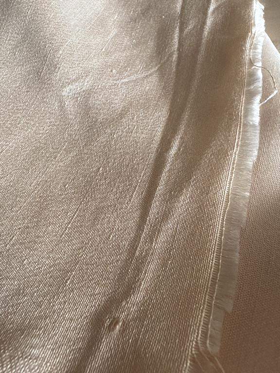 Textile fabric, likely a sheer chiffon or silk-blend ribbon or scarf with metallic sheen