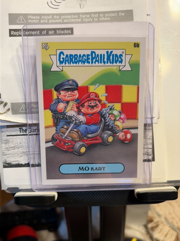 Trading card titled 'Mo Kart' from Garbage Pail Kids series