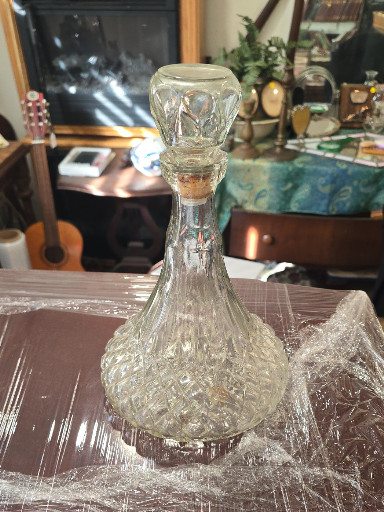 Pressed glass ship's decanter with diamond point pattern and stopper