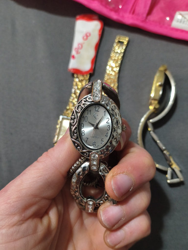 Silver-tone quartz bangle watch with marcasite-style crystal embellishments