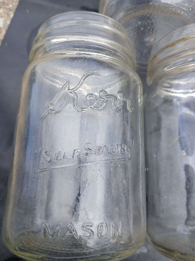 Clear glass 'Kerr Self-Sealing Mason' pint canning jar