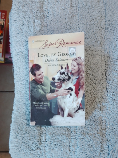 Paperback romance novel titled 'Love, by George' by Debra Salonen