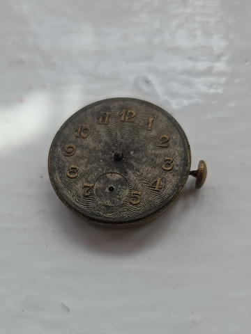 Vintage Swiss pocket watch movement with decorative dial