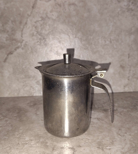 Stainless steel creamer pitcher with hinged lid by Vollrath