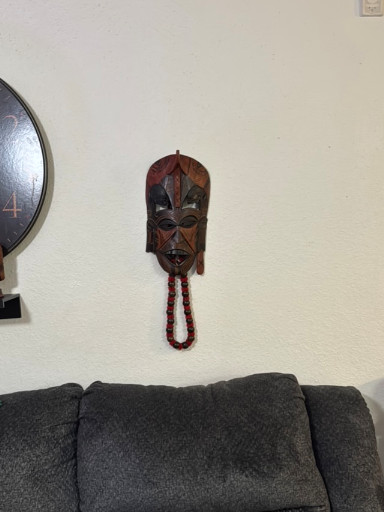 Hand-carved wooden African tribal mask