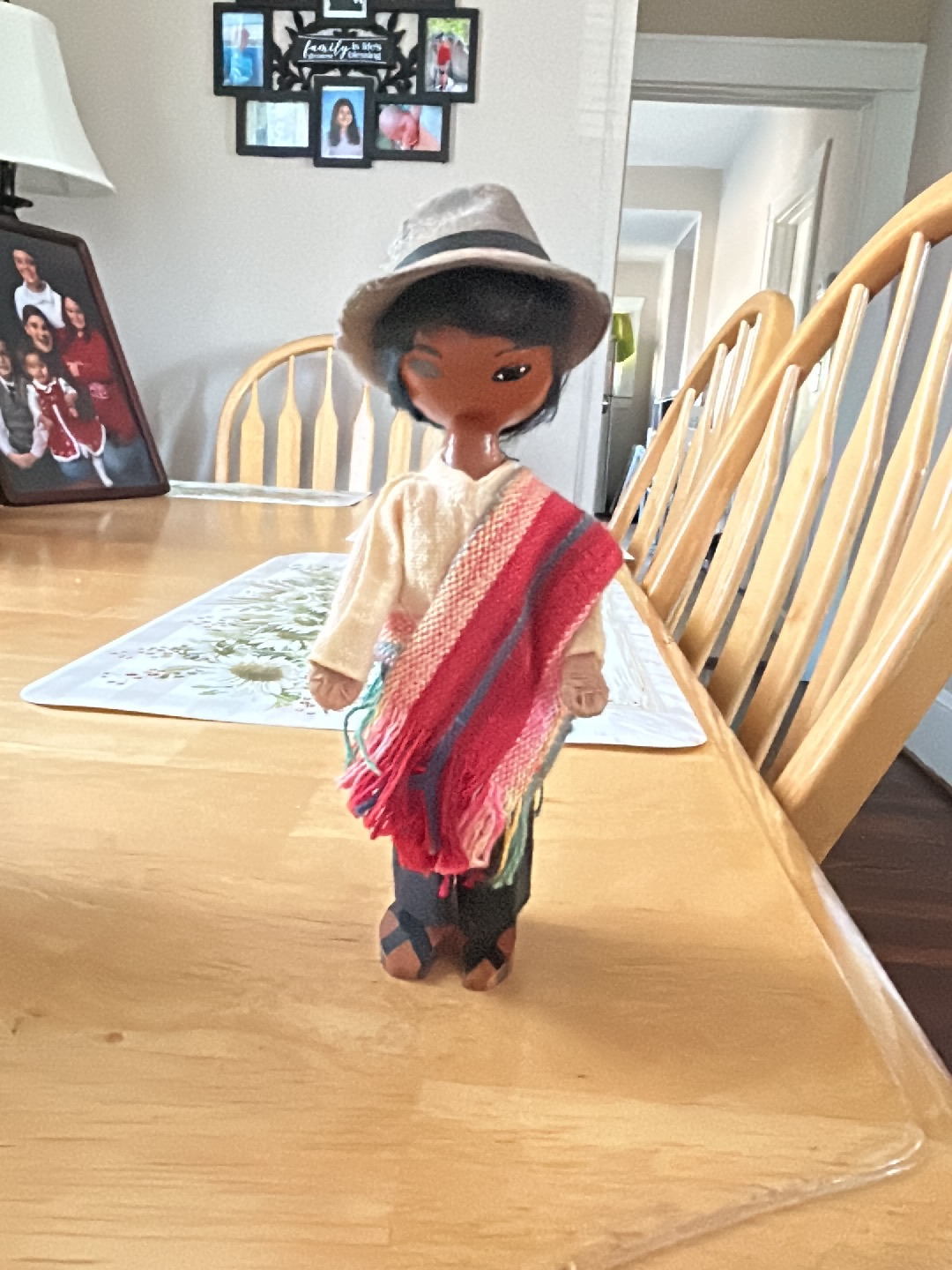 Peruvian folk art doll with traditional poncho and hat