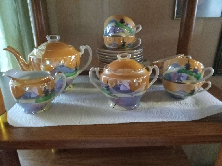 Japanese lusterware tea set with hand-painted lake scene