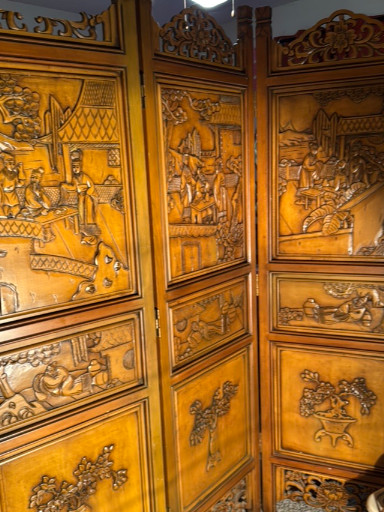 Carved wood six-panel folding screen depicting Chinese narrative scenes