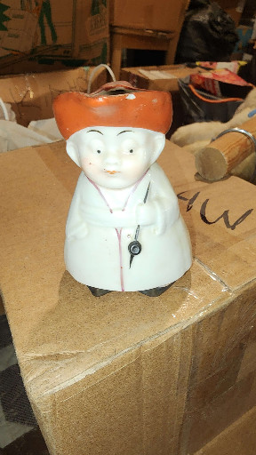 Ceramic Toby bell figurine depicting a man in traditional Dutch or colonial attire, made in Japan