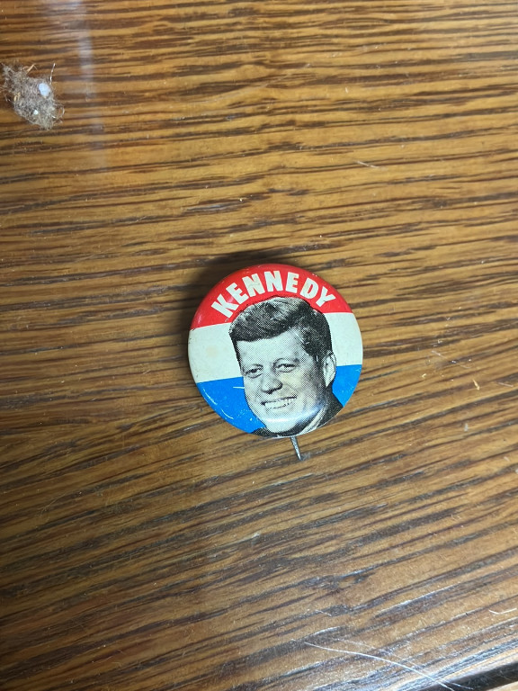Political campaign button featuring Kennedy