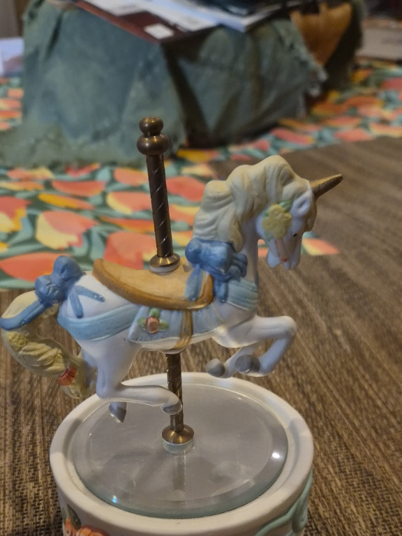 Porcelain carousel unicorn music box figurine