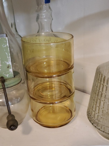 Set of amber glass stackable drinking glasses, circa 1970s