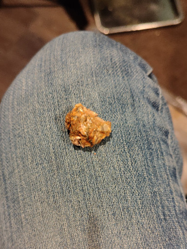 Natural gold ore specimen in quartz matrix