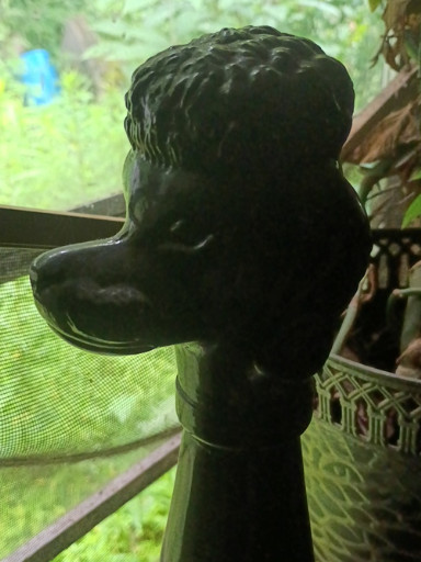 Black glass poodle decanter or bottle, likely Italian mid-century modern design