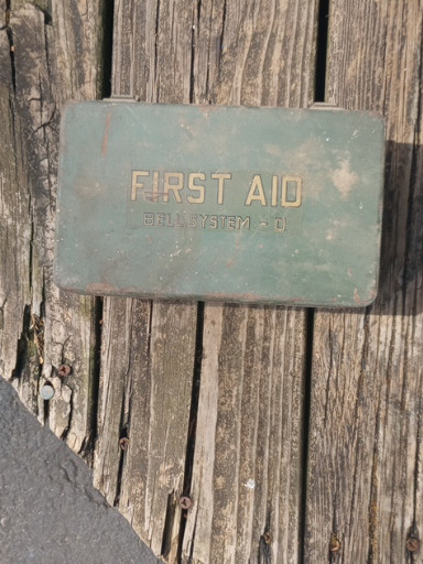 Metal first aid kit box marked 'Bell System C'
