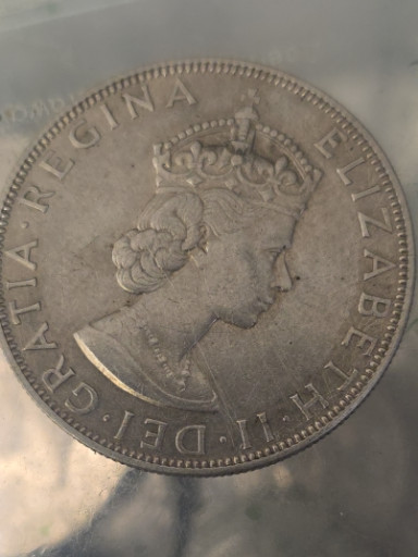 Silver crown coin featuring Queen Elizabeth II, issued by Bermuda in 1964