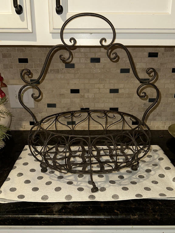 Wrought iron decorative basket titled 'Acanthus Votive Centerpiece' by Southern Living at Home