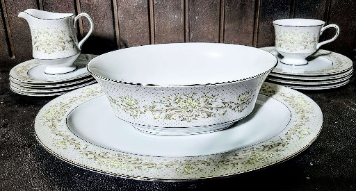 Porcelain dinnerware set with green floral pattern and platinum trim by Noritake