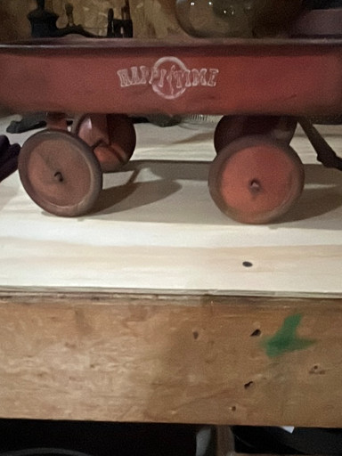 Vintage metal toy wagon titled 'All American' by an unknown manufacturer