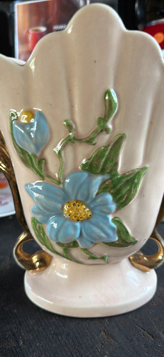 Hull Art pottery vase with hand-painted blue floral decoration and gold accents, made in USA
