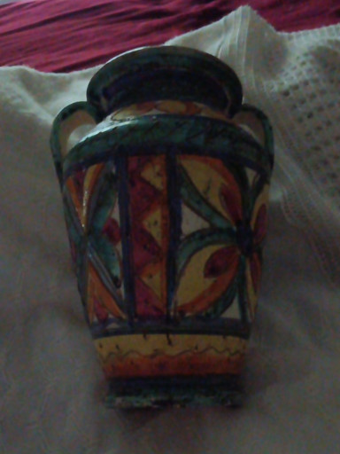 Hand-painted terracotta pottery vase with geometric sgraffito decoration