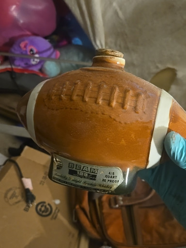 Ceramic football-shaped whiskey decanter by Jim Beam
